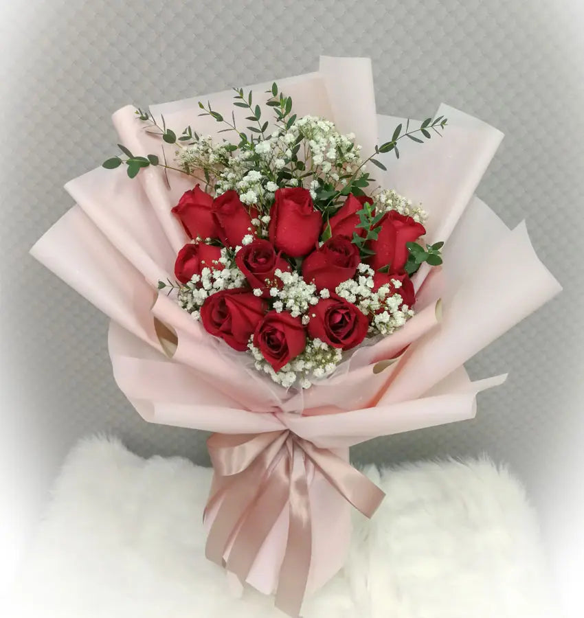 Red rose bouquet with baby's breath for same-day flower delivery in Dubai