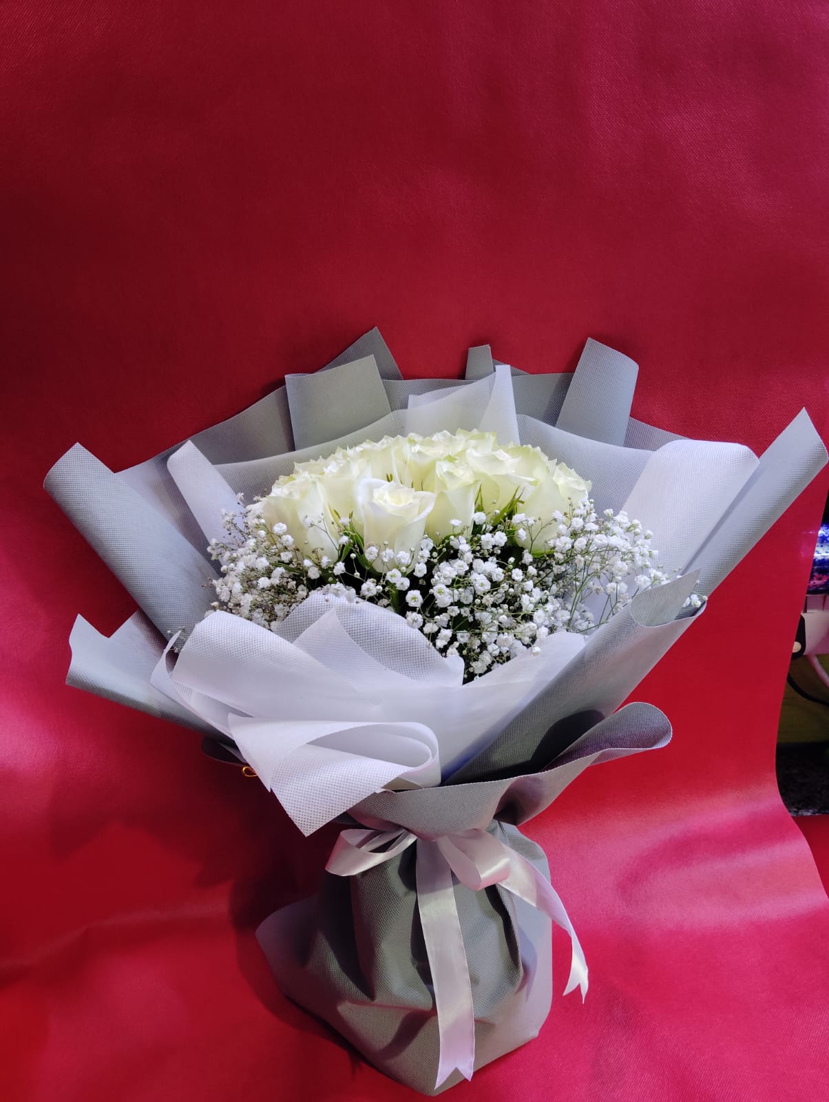 24 White Roses In Silver Wrapping