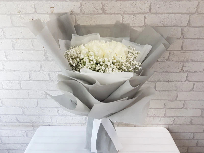 24 White Roses In Silver Wrapping