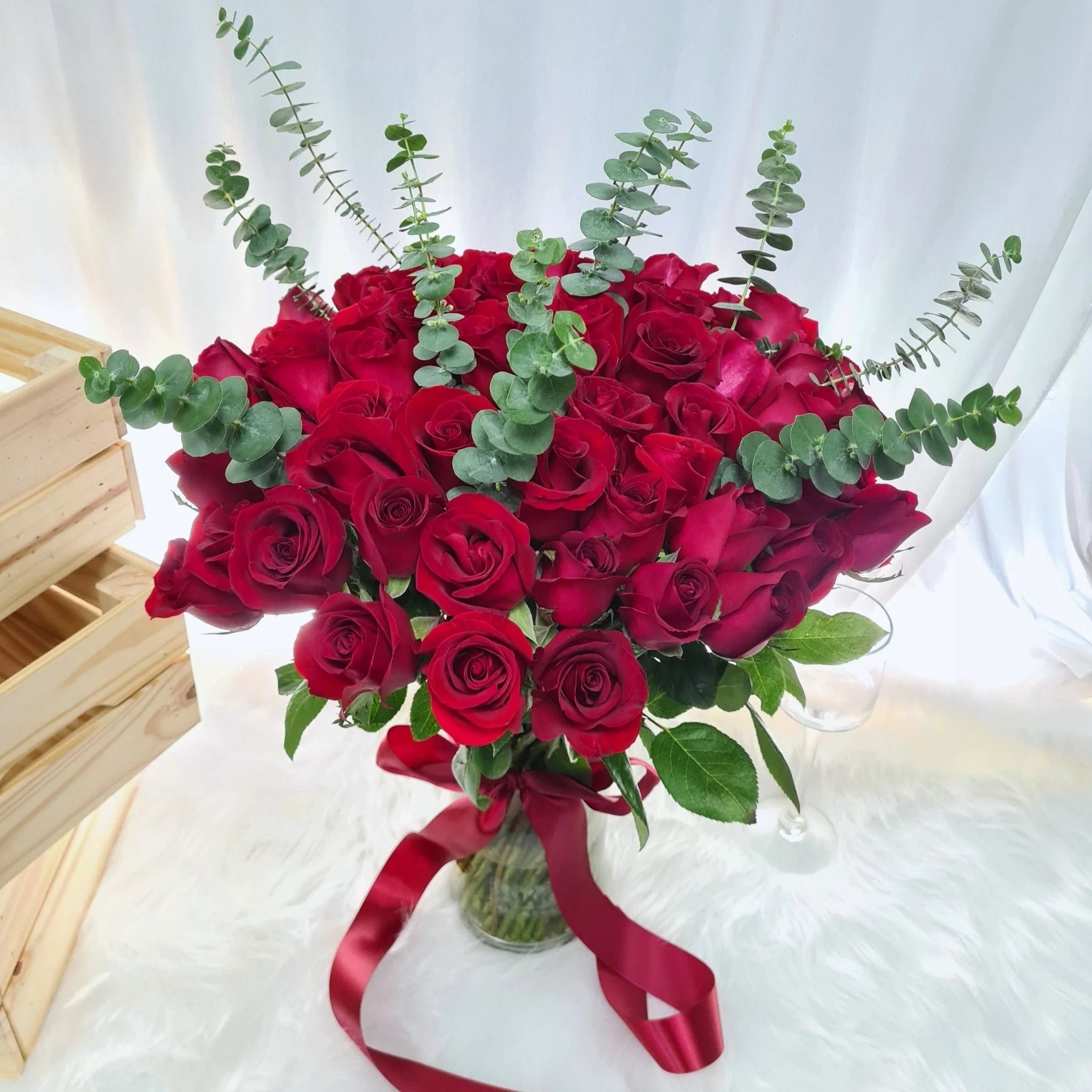 51 Red Rose's in Vase With Eucalyptus