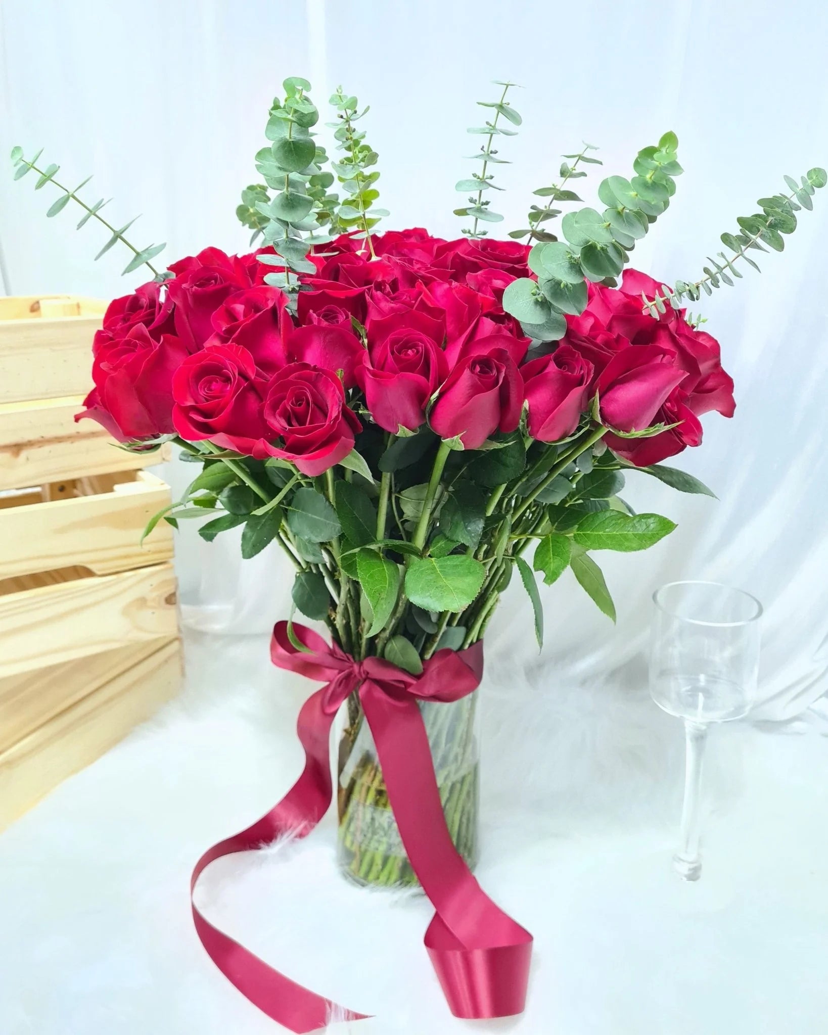 51 Red Rose's in Vase With Eucalyptus