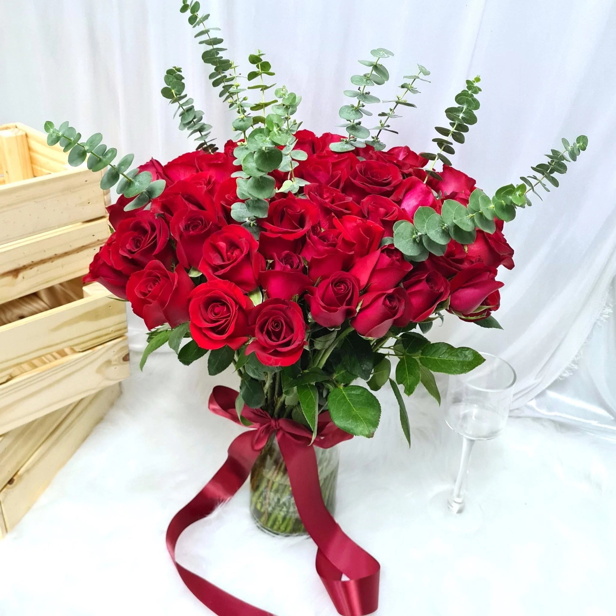 51 Red Rose's in Vase With Eucalyptus